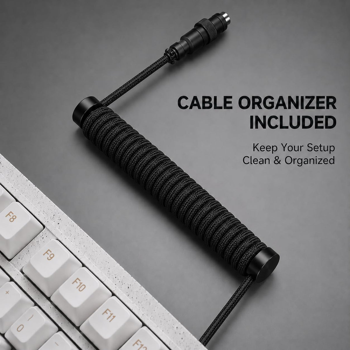 Black coiled keyboard cable supported by the optional weighted guide bar
